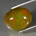 0.65CT ЭФИОПСКИЙ ОПАЛ МУЛЬТИКОЛОР (КАБОШОН) - Высокое качество. Доставка по Украине.